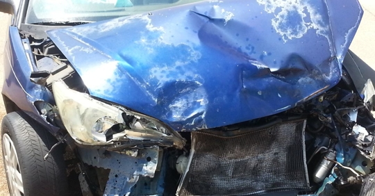 Car severely damaged after being involved in a car accident