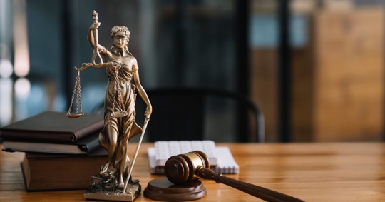 Personal injury attorney concept with Lady Justice at the forefront.