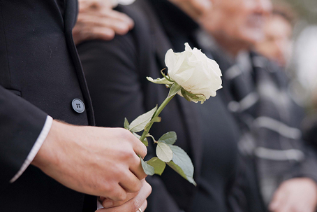 Widow holding a rose